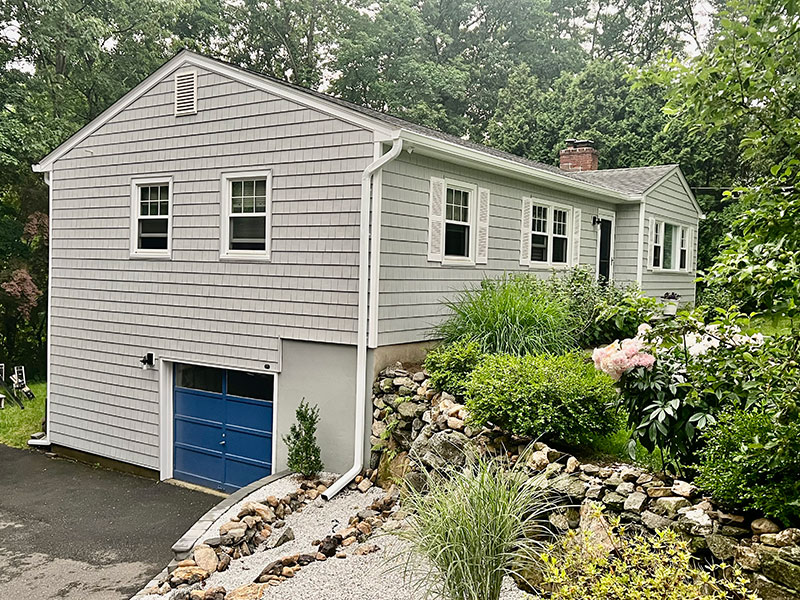 A house with a new roof, new siding and new gutters in Ridgefield, CT