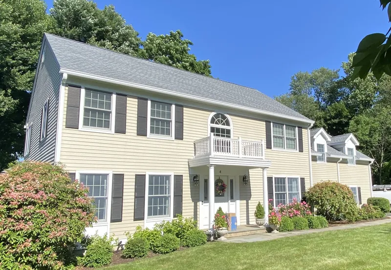 Roof replacement and new gutters on a Colonial-style home in Norwalk, CT