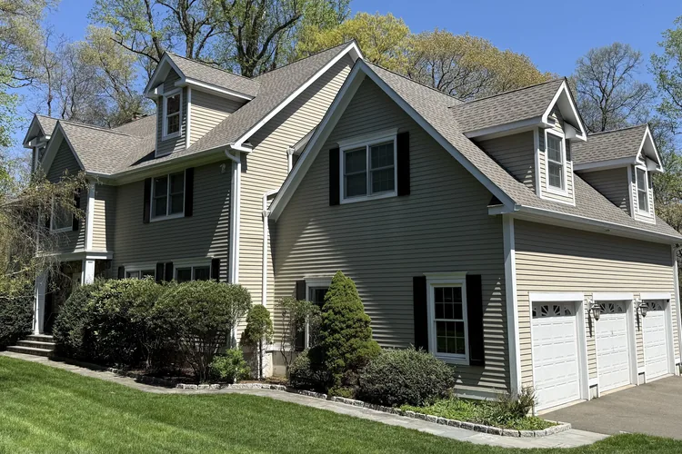 Completed roof replacement and seamless gutter installation in New Canaan, CT